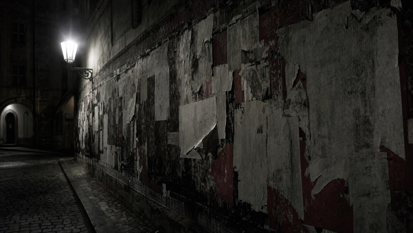 Illustrative image: a wall of torn posters. AI-generated, not a photograph.